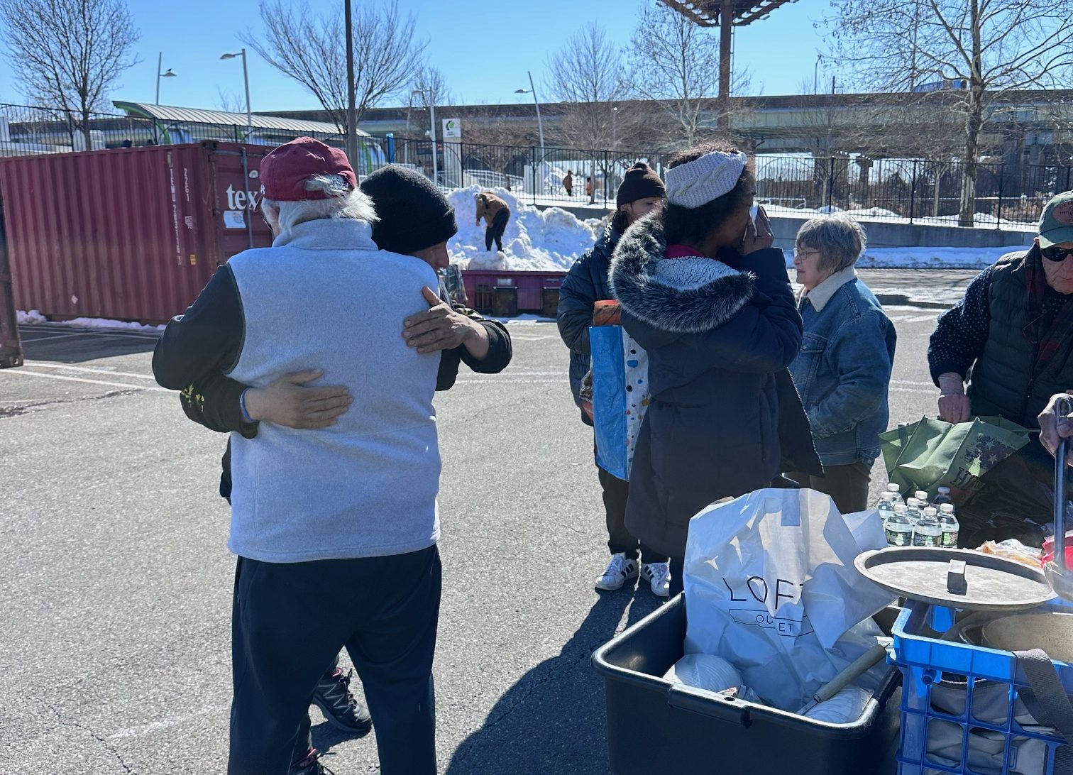 hugging homeless